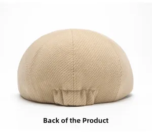 Detail view of the back of a beige wool blend newsboy cap showing elastic band