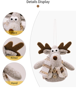 Detail view of knitted reindeer ornament showing fabric texture and wooden button accents