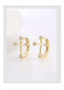 Detail showing S925 hallmark on gold plated asymmetric cross earrings with zircons
