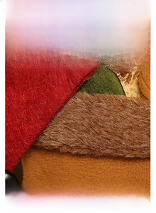 Macro detail of Christmas chair cover showing red felt and brown faux fur plush fabrics
