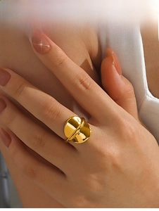 Detail view of a 18K gold-plated geometric ring featuring a unique dual-disc minimal design