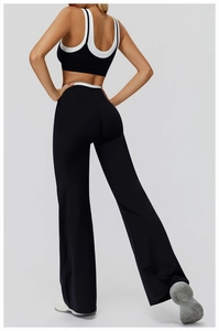 Vue arrière du pantalon de yoga évasé taille haute avec bordure contrastée blanche et stretch
