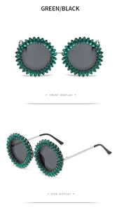 Front and side views of green crystal round sunglasses with black lenses and silver temples