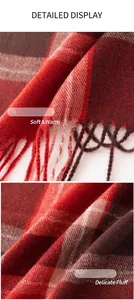 Close-up detail of soft red plaid cashmere scarf texture and delicate fringe edge