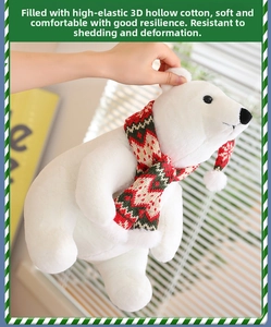 Detail of plush Christmas polar bear with striped scarf showing elastic cotton filling