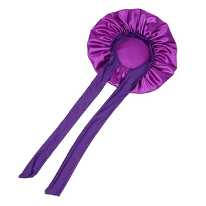 Detailed view of purple satin sleep bonnet with long ties and smooth silk texture