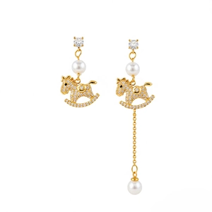 Asymmetric gold plated rocking horse earrings with sparkling zircons and white pearls