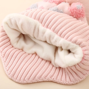 Pink winter knitted hat for girls with warm fleece lining and pom-pom decoration