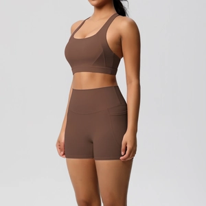 Detail of coffee brown high-waist yoga shorts with functional side pocket for storage