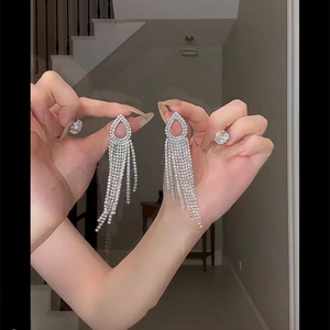 Exquisite silver drop earrings with shimmering diamond tassels for elegant banquet wear