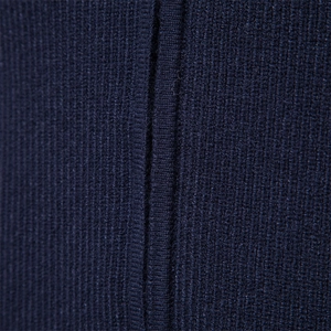 Macro shot of dark navy knit fabric showing vertical ribbing texture and fine fiber detail