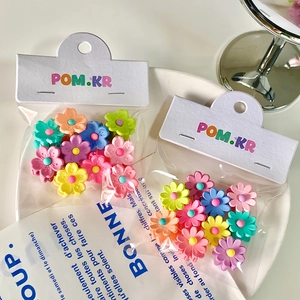 Candy colored mini flower hair claws in matte finish for girls hair styling accessories