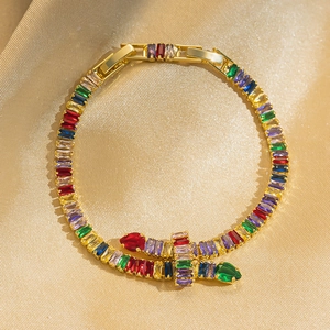 Luxurious gold plated snake bracelet with colorful zircon stones on champagne silk
