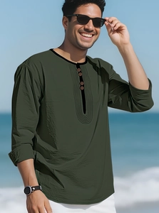 Detail of army green cotton linen long sleeve shirt featuring a henley neck and fabric texture