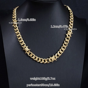 Detail view of 50cm gold Cuban link chain with barbed wire accents and size specifications