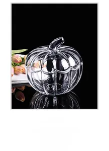 Detail view of pumpkin shaped crystal glass storage jar with a lid and ribbed texture