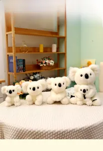 Plush koala toys in various sizes from 13cm to 28cm displayed on a textured white cloth