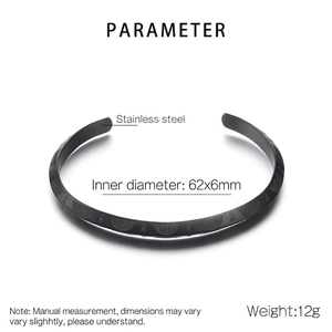 Black stainless steel C-shaped open cuff bangle with engraved geometric patterns