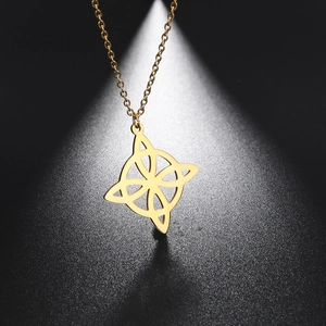 Macro shot of gold stainless steel compass necklace with hollow Celtic knot pendant