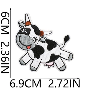 Detailed view of cartoon cow embroidered patch with clear stitching and size measurements