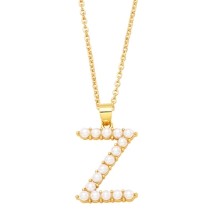Detailed close-up of capital letter Z pendant with gold base and white imitation pearls