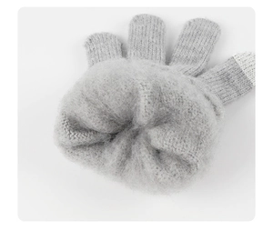 Detail of grey knitted glove featuring thick fleece lining and touchscreen fingertips