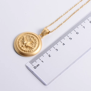 Gold plated stainless steel peace dove pendant necklace with scale showing 2.5cm diameter