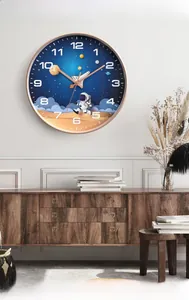 Detail of 10 inch silent kids wall clock with rose gold frame and astronaut theme dial