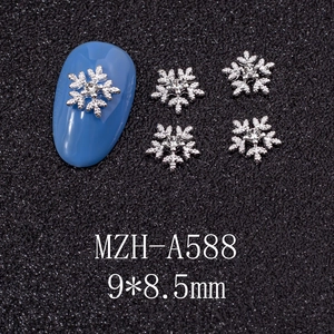 Detailed view of silver alloy snowflake nail charms with rhinestones sized 9x8.5mm