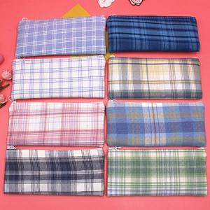 Detailed display of eight colorful checkered canvas pencil cases in various patterns