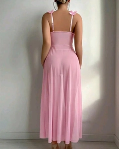 Detail view of pink mesh nightgown featuring delicate bow straps and an open back design