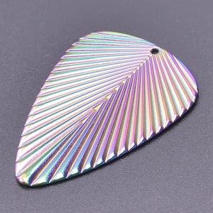 Macro detail of rainbow leaf charm showing 18k plated finish and realistic vein patterns