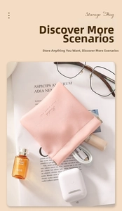 Pink faux leather travel pouch featuring a squeeze-top self-closing metal spring frame