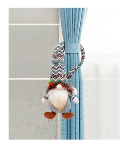 Detail of Christmas gnome curtain buckle with knitted hat and plush beard decoration