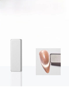 Macro shot of silver dual-head magnetic nail tool for cat eye gel polish 2.9cm x 0.9cm