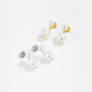Detailed view of irregular baroque pearl earrings with S925 silver stamp in gold and silver