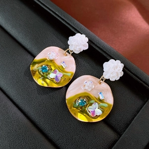 Vintage floral drop earrings with colorful resin butterfly charms and blue gemstones