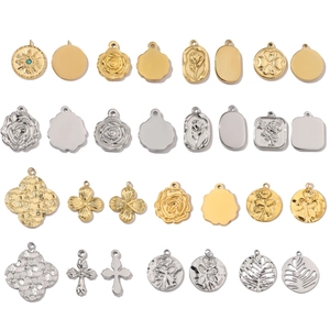 Polished stainless steel pendants in gold and silver showing varied shapes and patterns