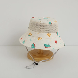 Detail of kids sun hat with mesh vents, cartoon dinosaur print and adjustable chin strap