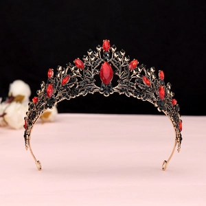 Detailed macro view of baroque crown with red crystals and black rhinestones