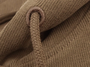 Detailed macro view of the soft knit fabric and woven drawstring of this casual brown set