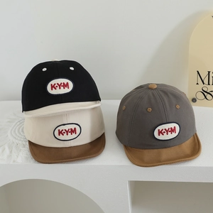 Baby baseball caps with KYM embroidery in black, beige and dark grey color options