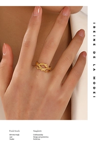 Detail of 18K gold plated double-layer knot ring showing braided texture on hand