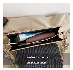 Detail view of beige quilted crossbody bag showing spacious multi-compartment interior