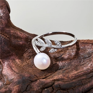S925 sterling silver leaf ring with natural freshwater pearl and tiny diamonds on wood