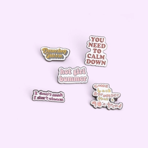 Set of five enamel alphabet pins with Dancing Queen and Hot Girl Bummer slogans