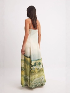 Elegant back view of floral landscape print satin maxi dress with spaghetti straps