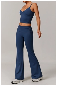 Detail view of high-waist flared leggings and V-neck camisole in navy yoga set