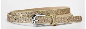 Detail of a thin gold glitter belt with a silver metal pin buckle on white background