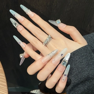 Extra long stiletto press-on nails with blue gradient, silver glitter and crystals